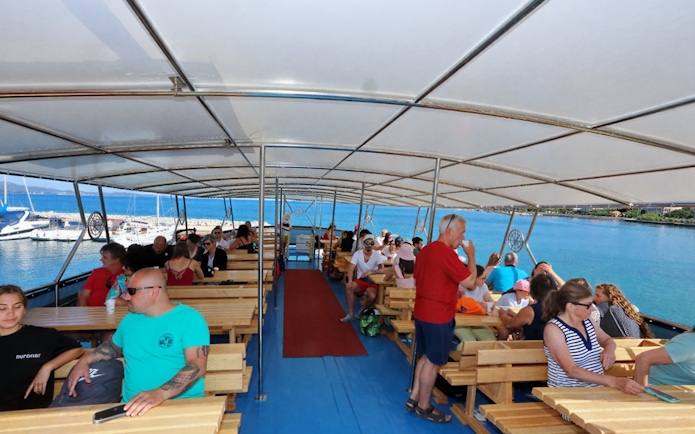 Guests seated on a boat tour from Zadar, enjoying views of the Adriatic Sea.