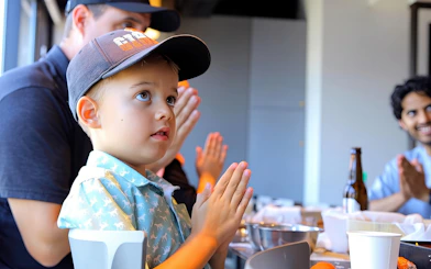 Child participating in sushi making class in Asakusa, Tokyo.