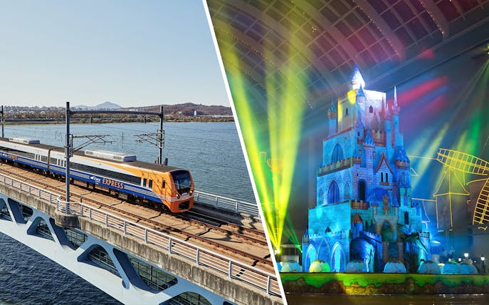AREX Incheon Airport Express Train on bridge and illuminated castle at Lotte World, Korea.