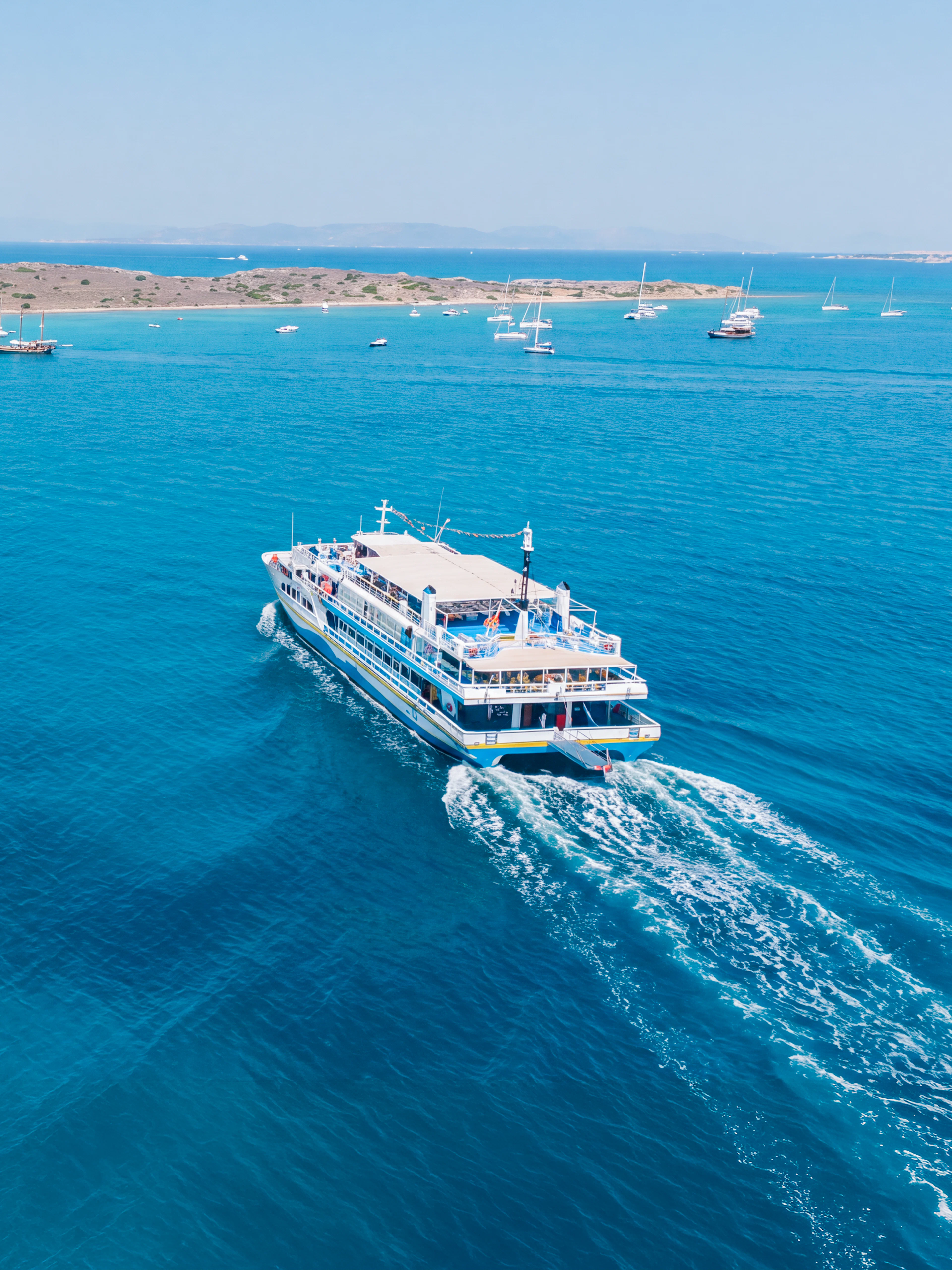 Cruise ship sailing near Metopi, Agistri, and Aegina Islands in Greece.