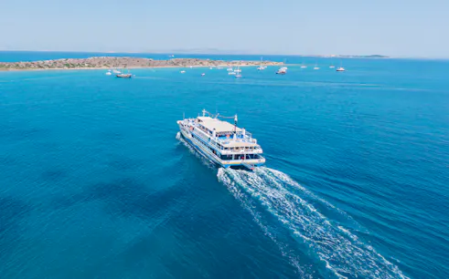 Cruise ship sailing near Metopi, Agistri, and Aegina Islands in Greece.