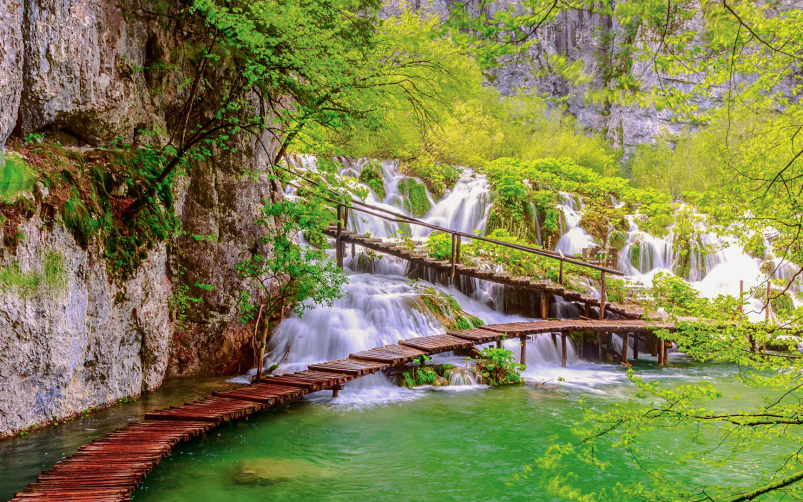 Wooden path over waterfalls at Plitvice Lakes National Park, Croatia.