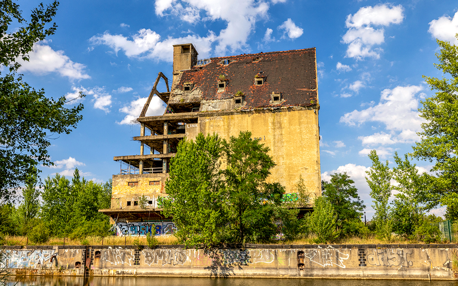 Old warehouse building with graffiti at the port of Lindenau, Leipzig.