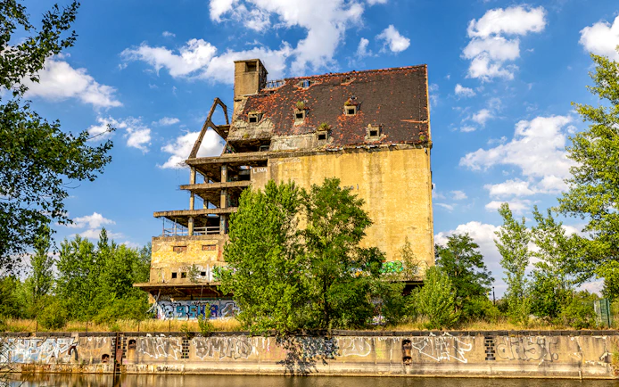 Old warehouse building with graffiti at the port of Lindenau, Leipzig.