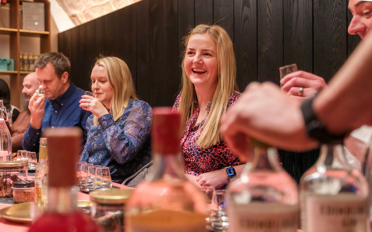 Visitors enjoying a whisky tasting at an Edinburgh distillery.