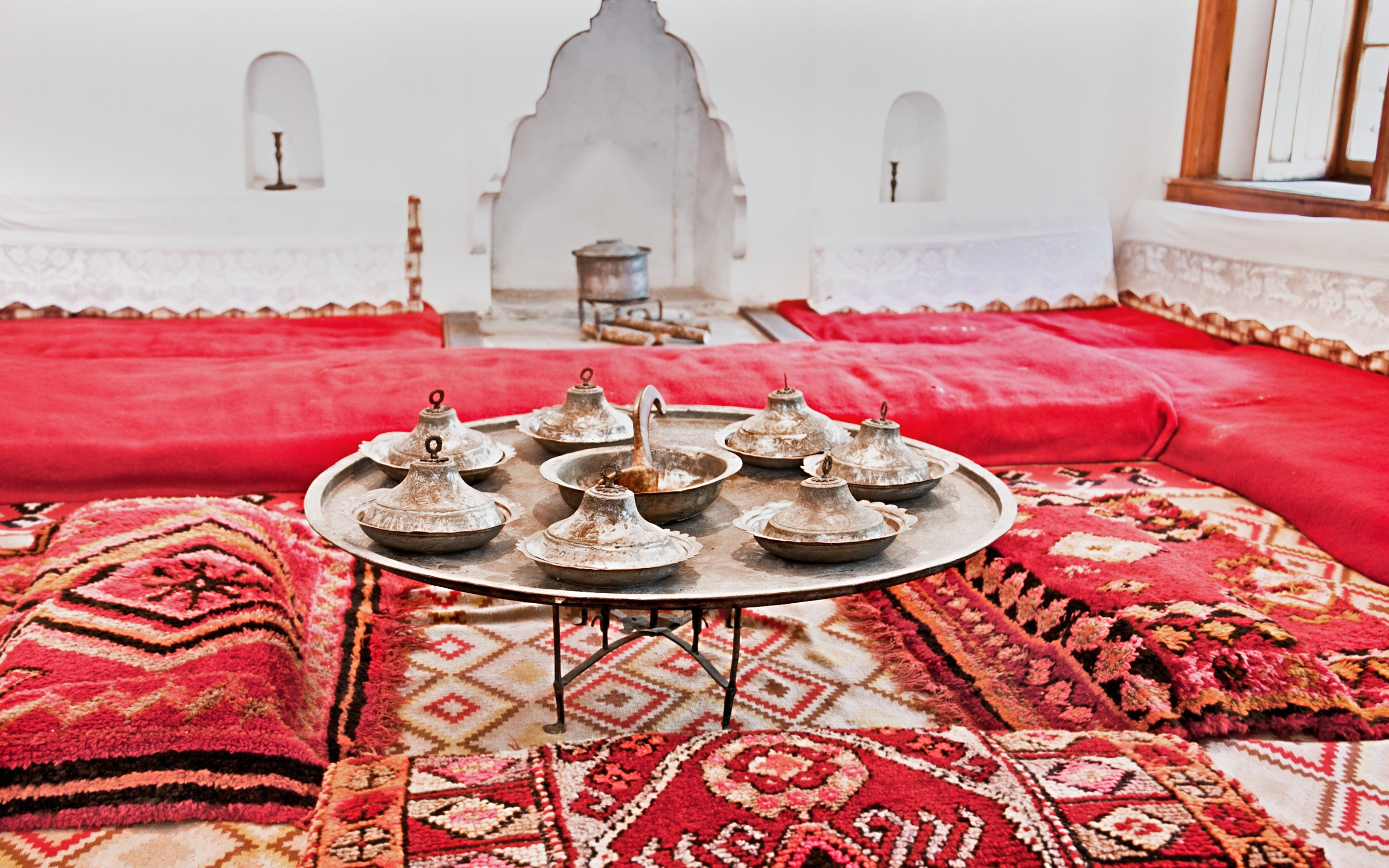 Traditional Albanian room with metal serving dishes on a tray, inside ethnographic museum, Kruje.