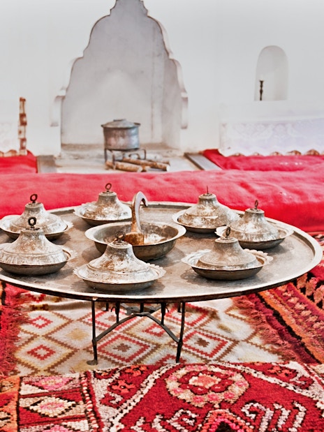 Traditional Albanian room with metal serving dishes on a tray, inside ethnographic museum, Kruje.