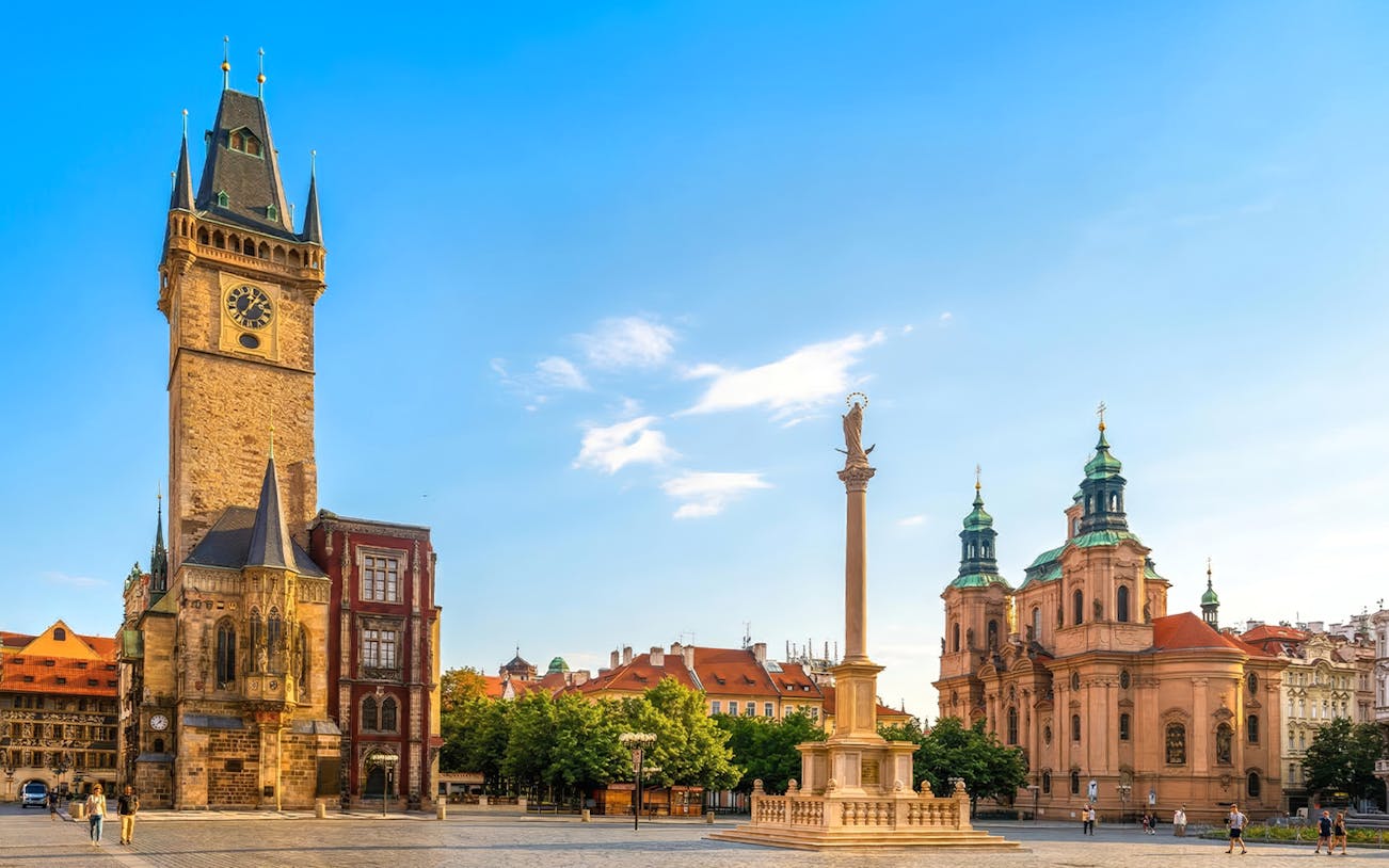 Astronomical Clock Tower and St. Nicholas Church in Old Town Square, Prague.