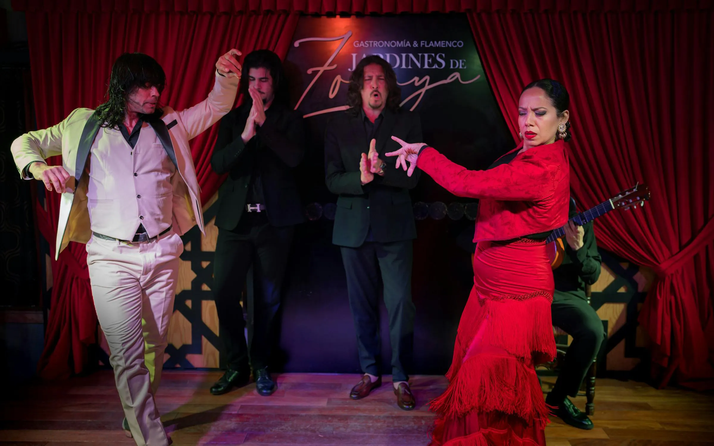 Flamenco dancers performing at Tablao Jardines de Zoraya in Granada, Spain.