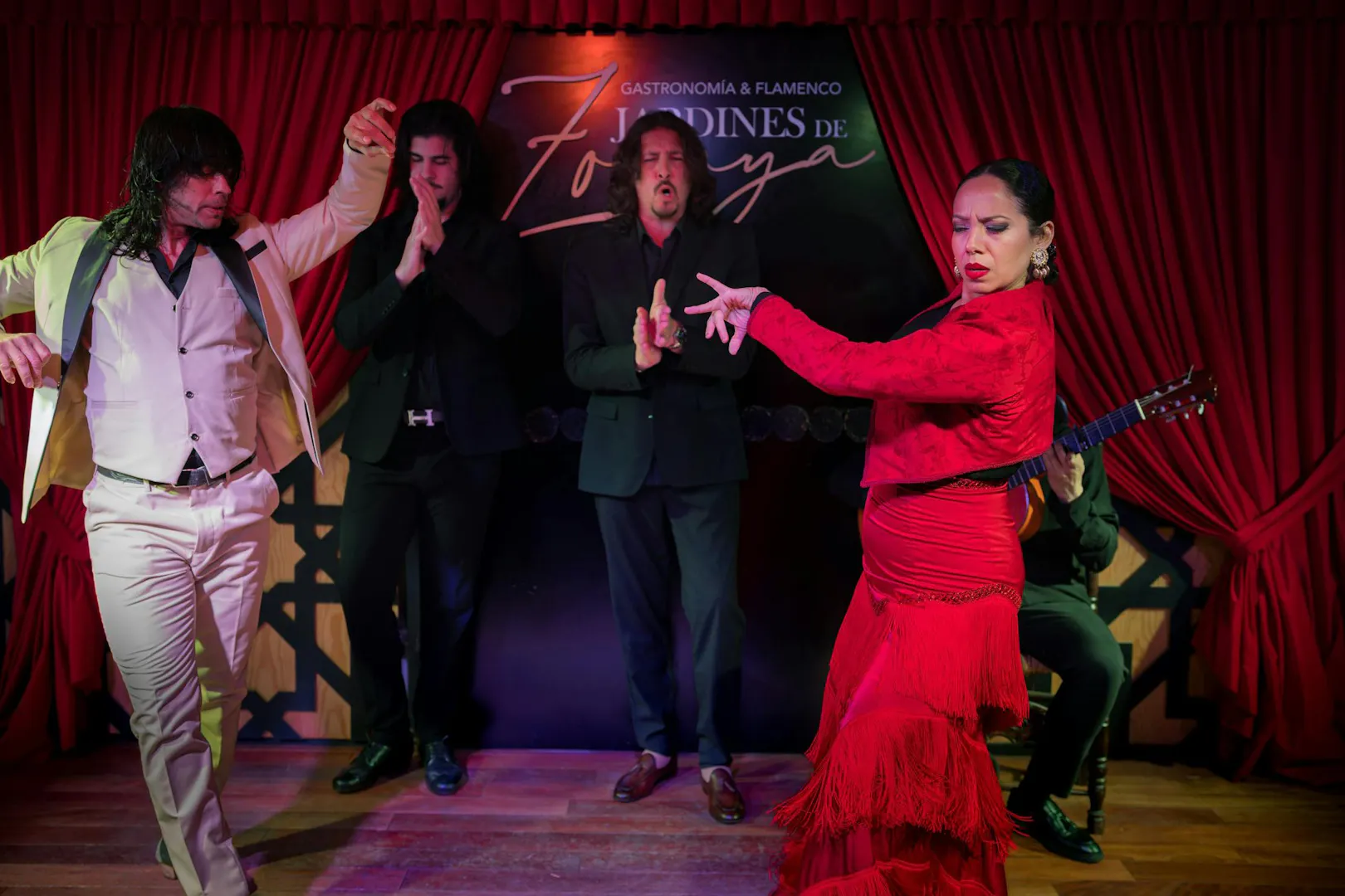 Flamenco dancers performing at Tablao Jardines de Zoraya in Granada, Spain.