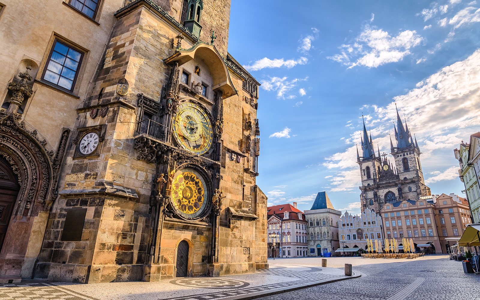 Astronomical clock tower from ant's eye view on a sunny day