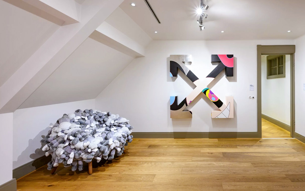 KAWS and Banksy artworks displayed at Moco Museum, Amsterdam art tour.