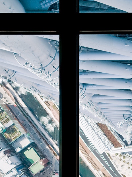 View from Tokyo Skytree observation deck overlooking city streets below.
