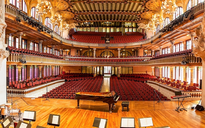 Palau de la Musica Catalana interior with ornate balconies and stage in Barcelona.