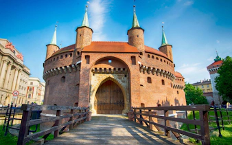 Krakow Barbican entrance with bridge, part of Krakow Museum Pass tour.
