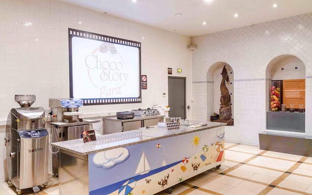 Choco-Story Paris museum exhibit showcasing chocolate-making tools and historical artifacts.