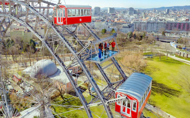 Passengers viewing Vienna cityscape from the Giant Ferris Wheel.