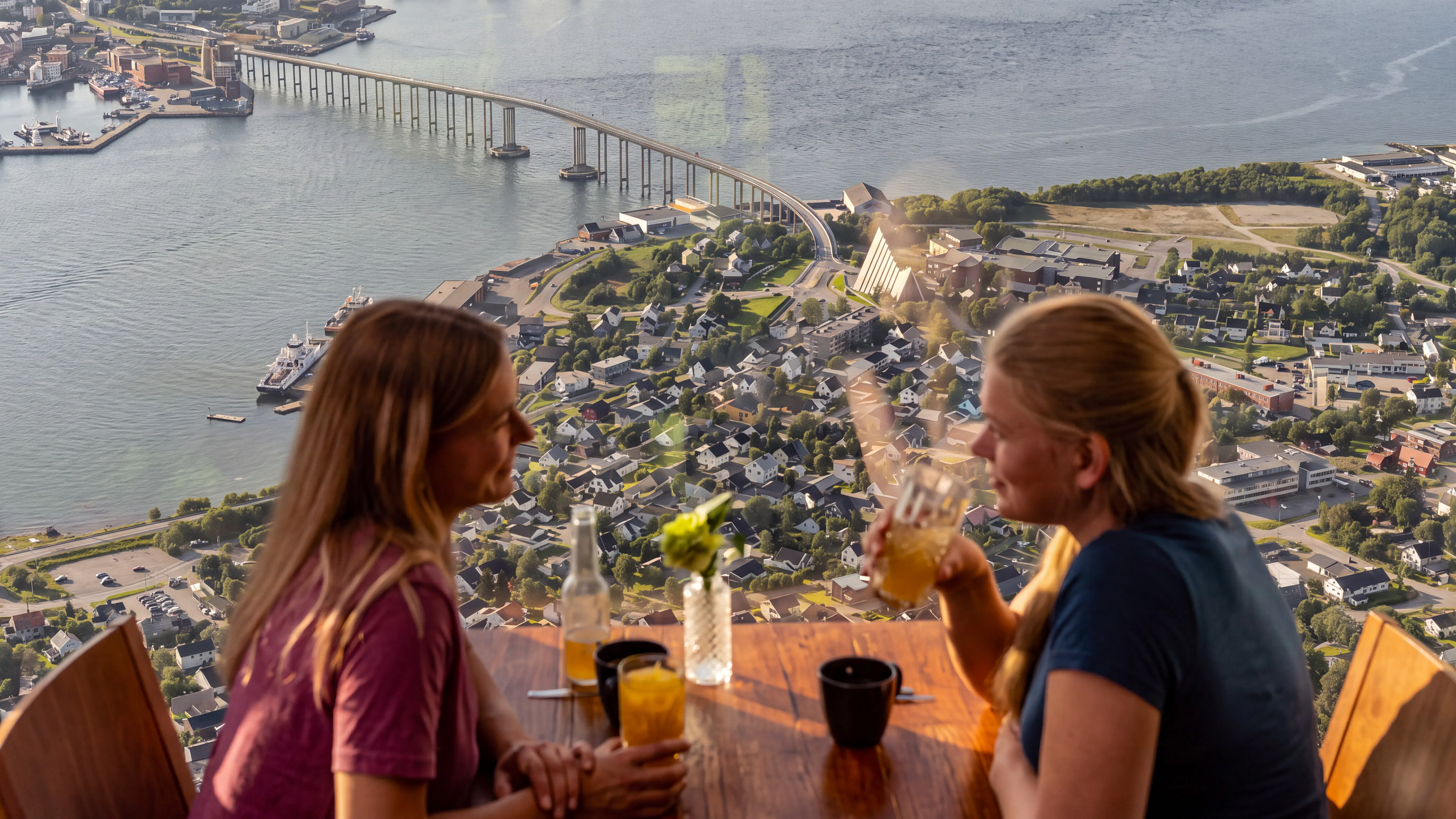 View from inside the Fjellheisen cable car in Tromsø, overlooking the city and bridge.