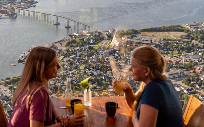 View from inside the Fjellheisen cable car in Tromsø, overlooking the city and bridge.