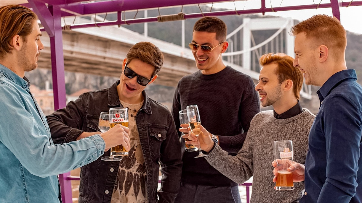 Group of friends enjoying drinks in cruise