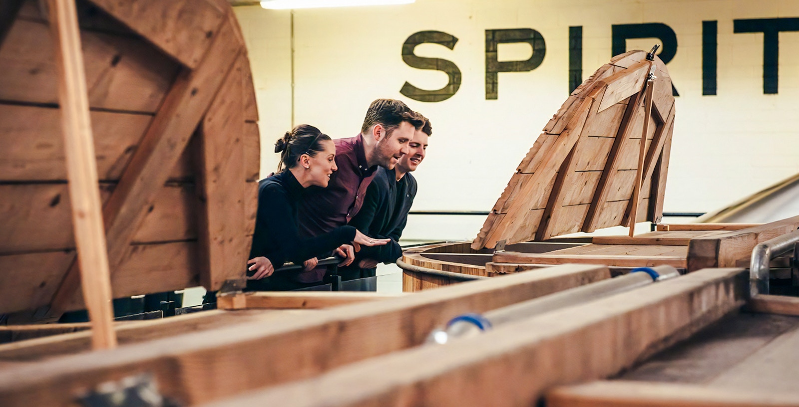 Visitors observing whiskey fermentation at Teeling Whiskey Distillery, Dublin.