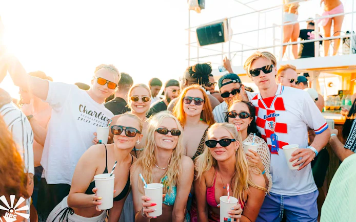 Guests enjoying drinks on Blue Lagoon Yacht Party from Split.