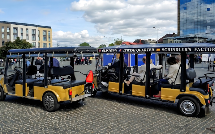 Golf cart tour in Krakow's Jewish Quarter near Schindler's Factory Museum.