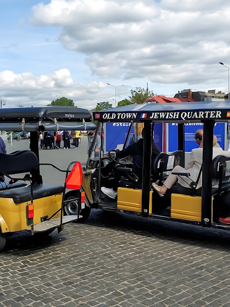 Golf cart tour in Krakow's Jewish Quarter near Schindler's Factory Museum.