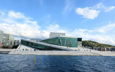 Oslo Opera House with visitors walking on the sloped roof, Oslo Walking Tour.