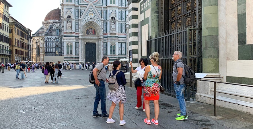 Tour group with guide outside Duomo Florence, Italy.