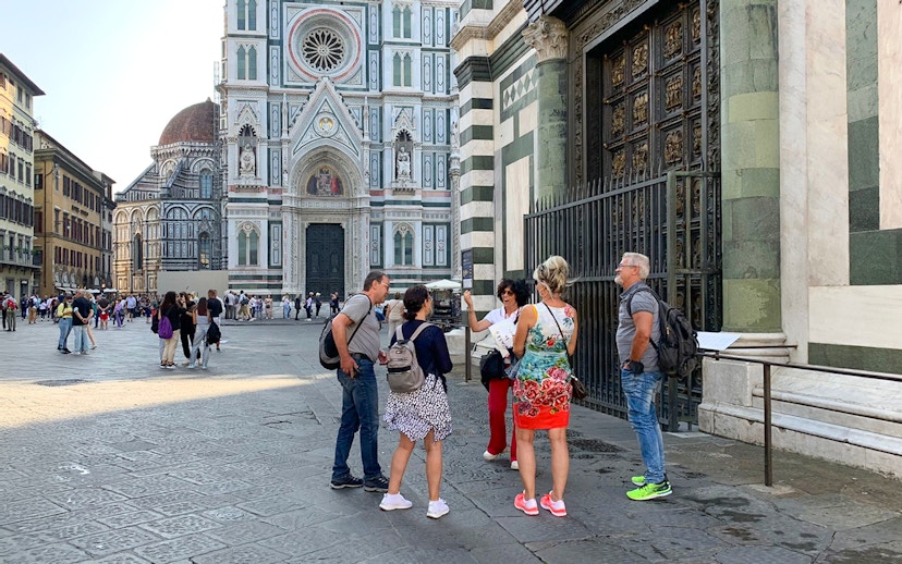 Tour group with guide outside Duomo Florence, Italy.