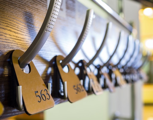 Cloakroom with coat racks and storage lockers.