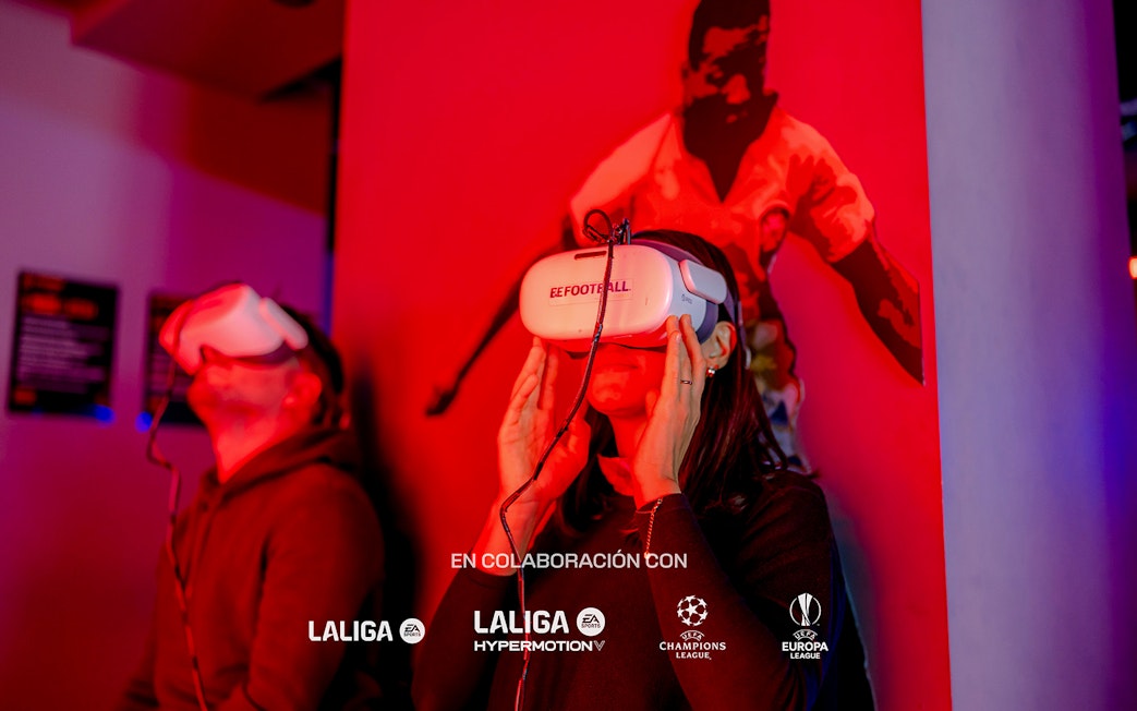 Visitors using VR headsets at Legends of Football Museum exhibit.