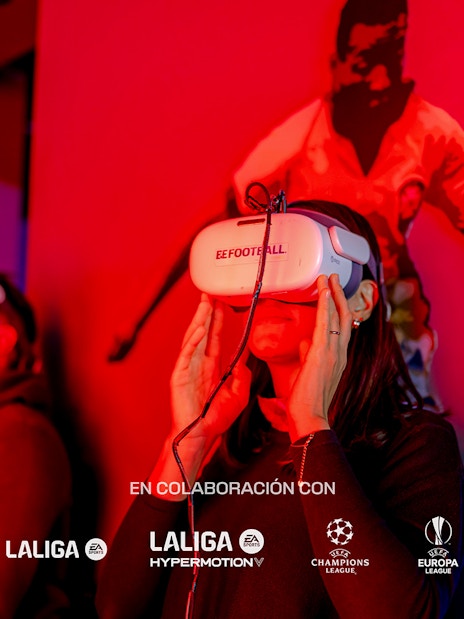 Visitors using VR headsets at Legends of Football Museum exhibit.