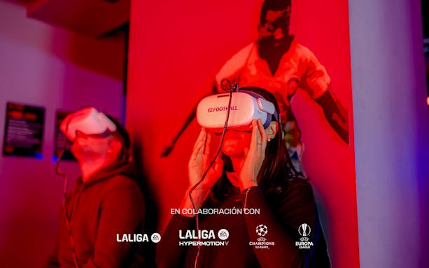 Visitors using VR headsets at Legends of Football Museum exhibit.