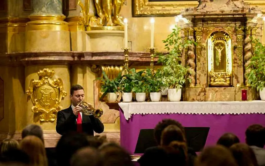 Trumpet player performing at St. Anne's Church, Vienna during Magic Trumpet Christmas Concert.