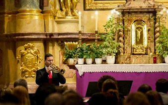 Trumpet player performing at St. Anne's Church, Vienna during Magic Trumpet Christmas Concert.