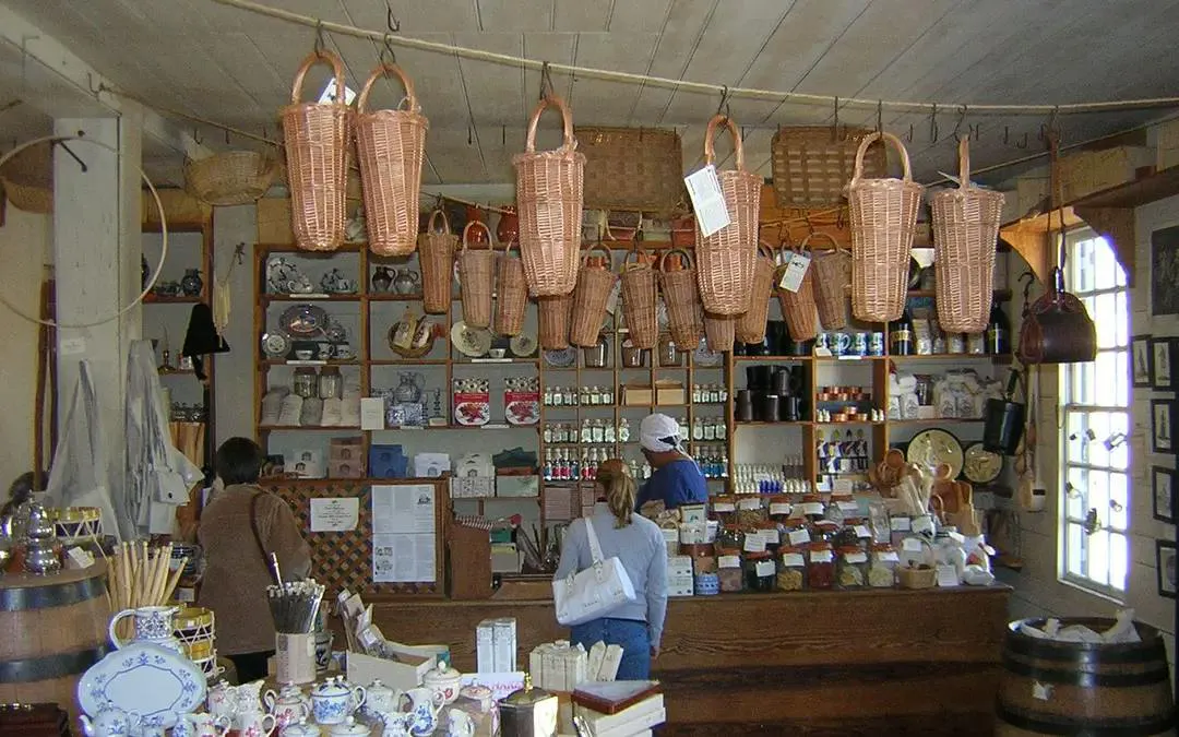 Colonial shop interior with baskets and pottery, Williamsburg self-guided city exploration game.