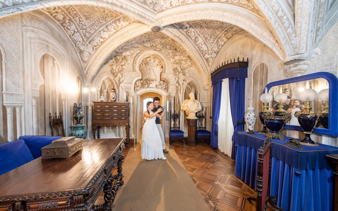 Couple with guide in the ornate dining room of Pena Palace, Sintra.