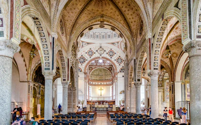 Interior of Church Santa Maria delle Grazie, Milan, showing ornate arches and altar.