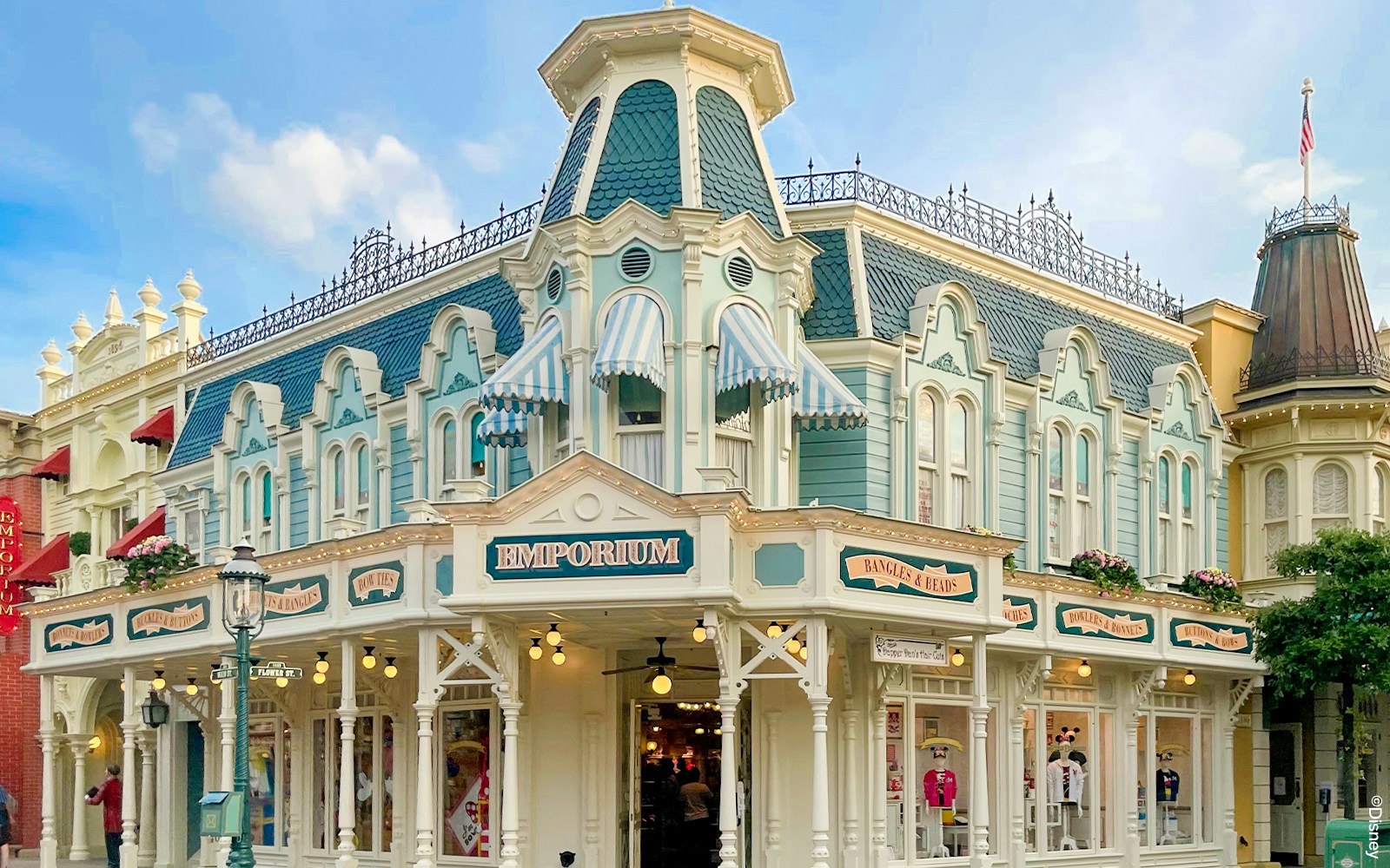 Emporium Shop facade at Disneyland Paris with Victorian architecture.