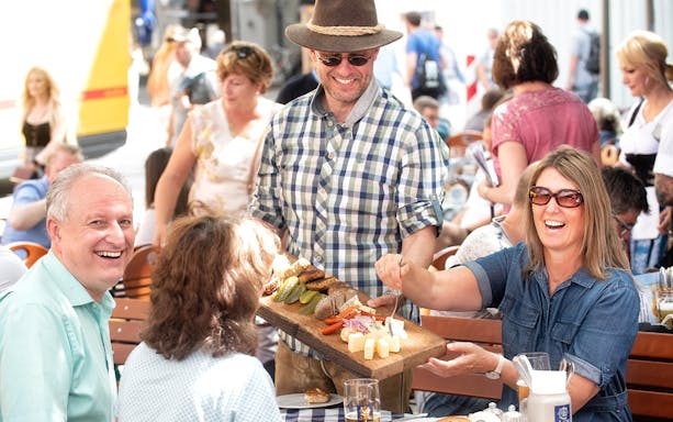 Group enjoying traditional Bavarian snacks on a Munich beer tour.