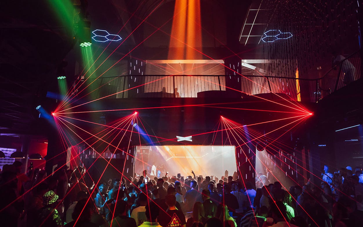 Crowd enjoying a vibrant laser light show at Eden nightclub on Wednesday with Todd Terry.