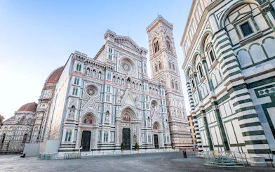 Florence Duomo exterior with bell tower and cupola, Italy.