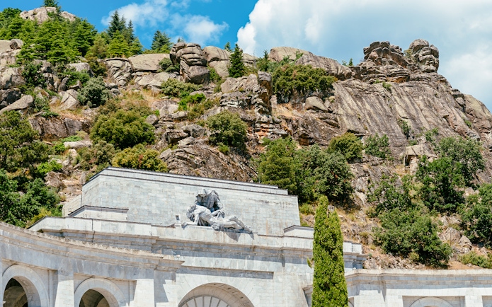 Valley of the Fallen monument with rocky hillside in Spain.