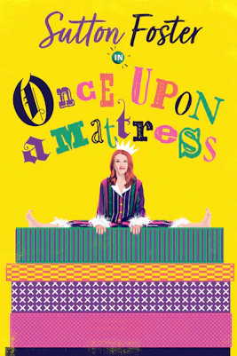 Cast performing "Once Upon a Mattress" musical on stage with vibrant costumes and set design.