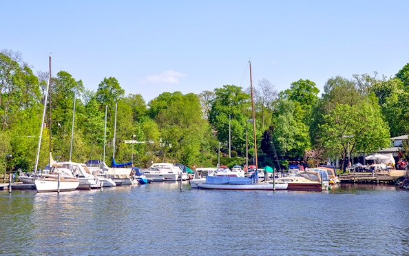 Boats docked at Great Wannsee lake port during Seven Lakes Tour from Berlin.