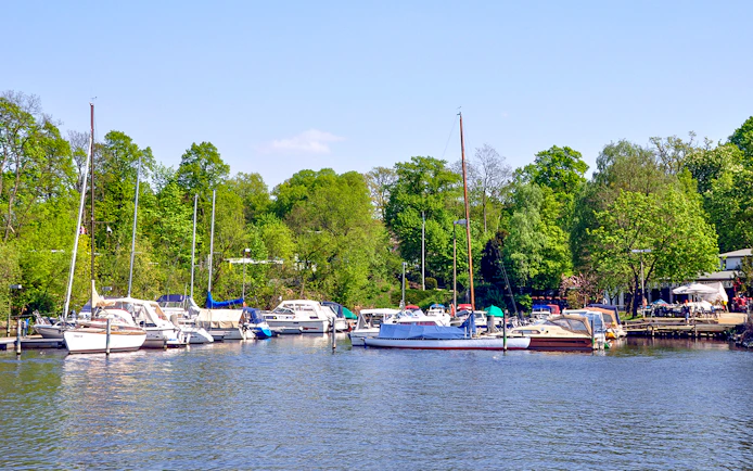 Boats docked at Great Wannsee lake port during Seven Lakes Tour from Berlin.