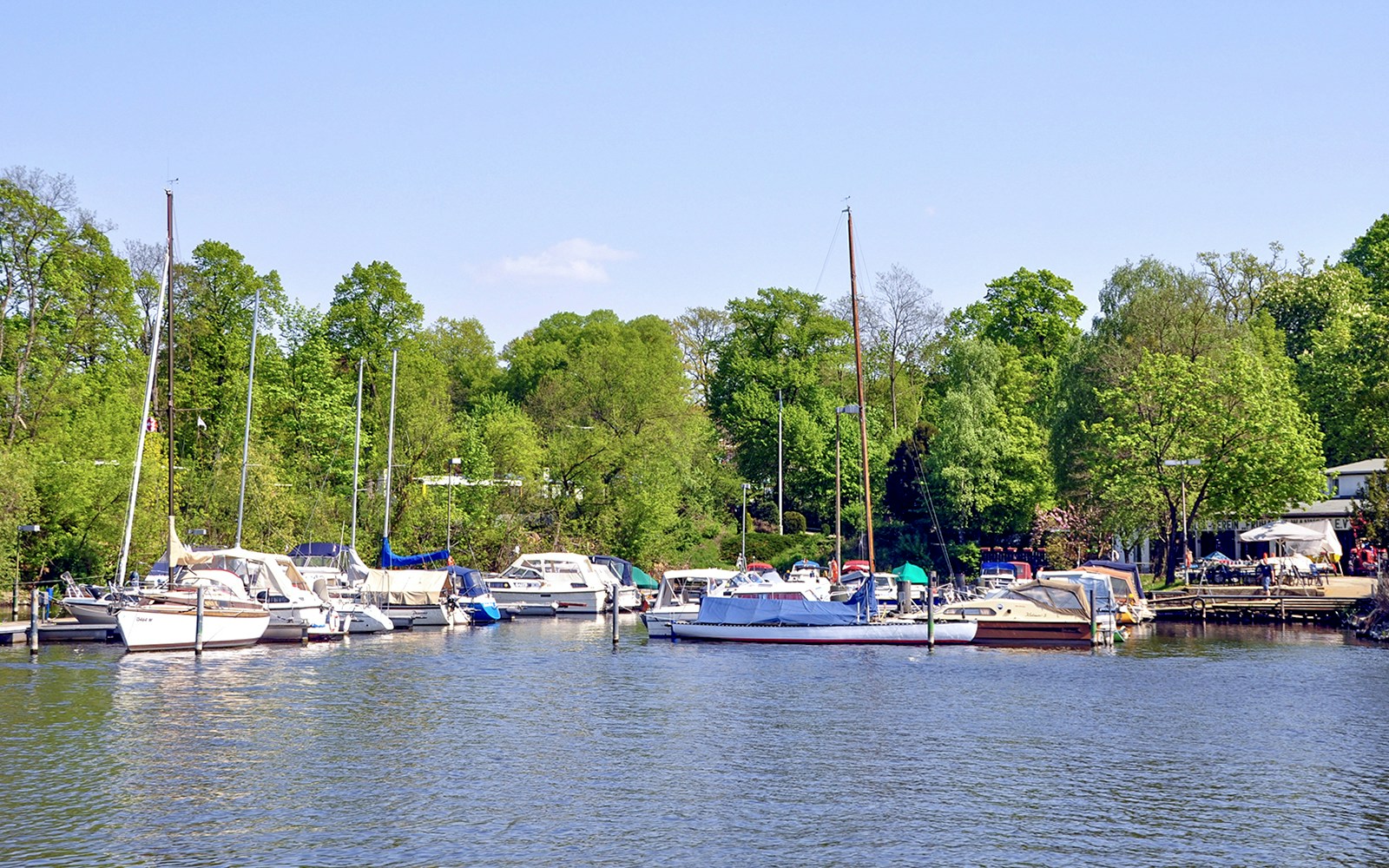 Boats docked at Great Wannsee lake port during Seven Lakes Tour from Berlin.