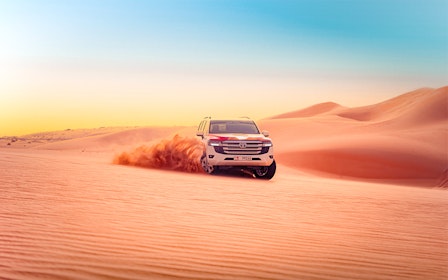 Abu Dhabi Evening Desert Safari with 4x4 Dune Bashing, Camel Ride, & BBQ Dinner 